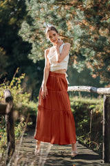  Woman wearing Silk Closet Orange Brown Tiered Maxi skirt outside